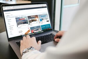 a laptop open with a person shopping online